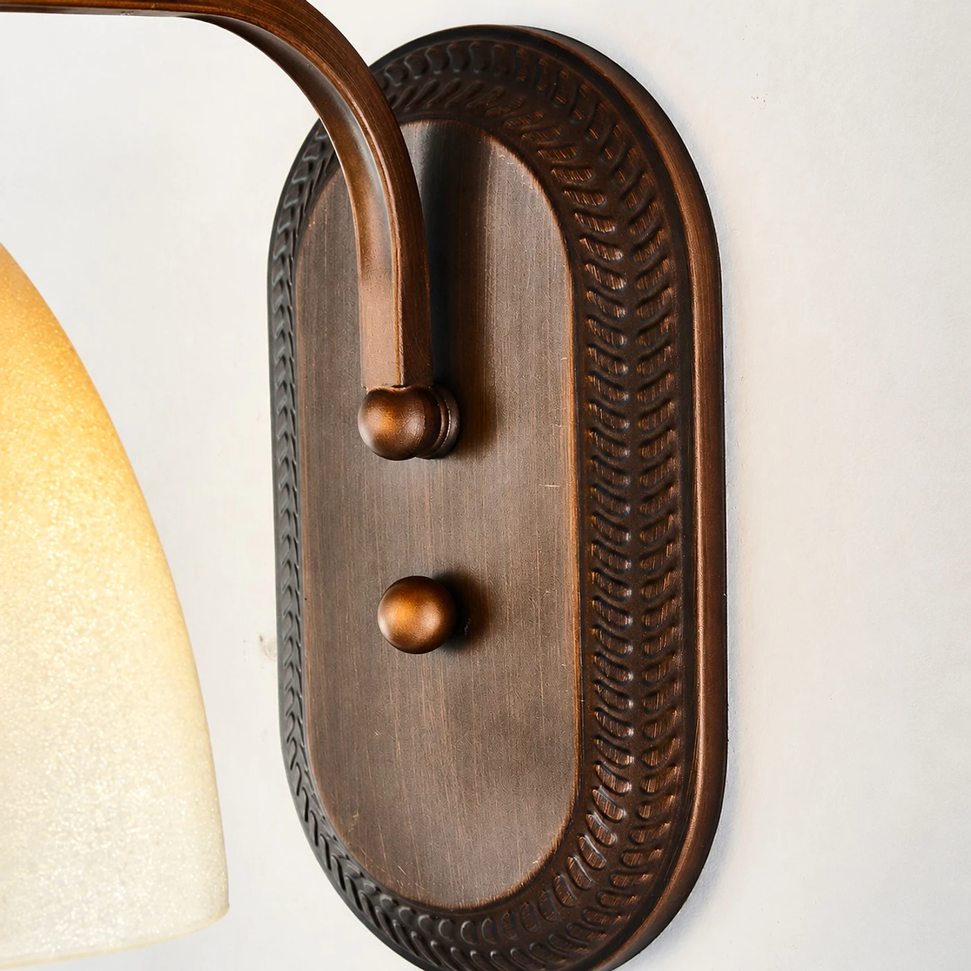 Antique bronze amber glass wall sconce
