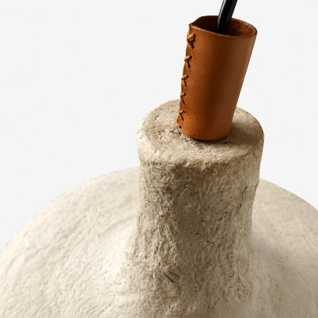 Close detail of the paper texture and warm wooden top socket